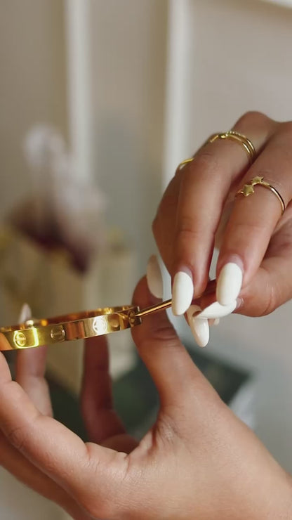 Gold Cartier hoop with screwdriver