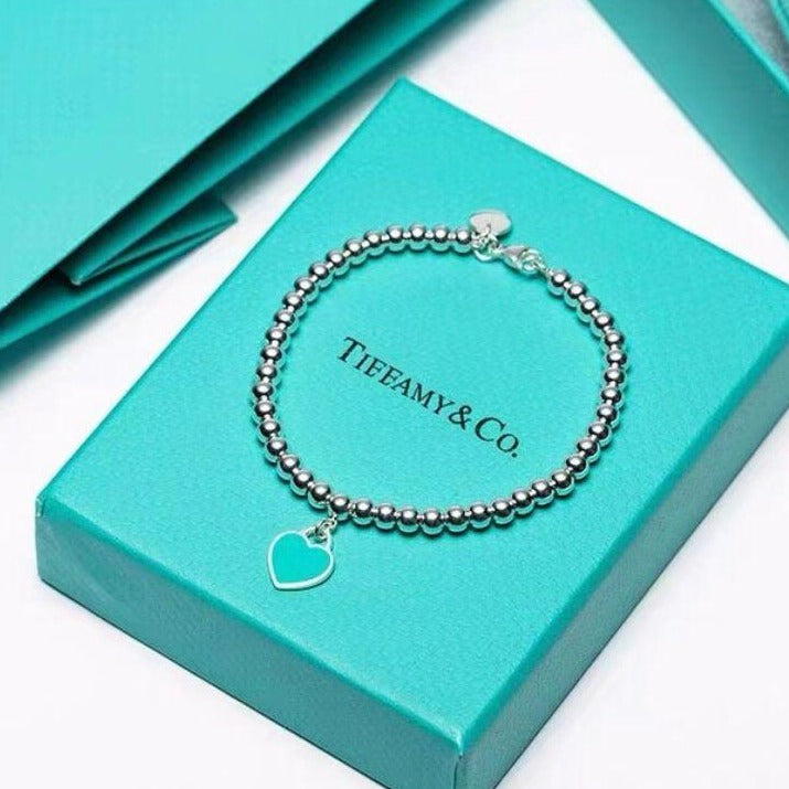 Tiffany Military bracelet and heart pendant