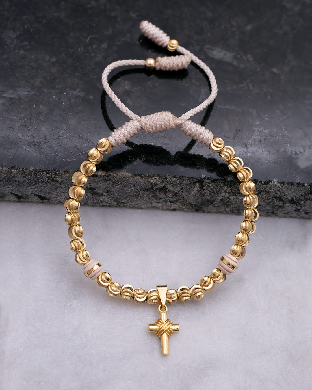 Bracelet with diamond ball and cross pendant